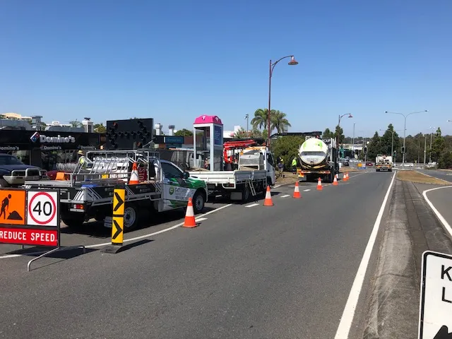 Traffic control vehicles, cones and reduced speed signage during road works